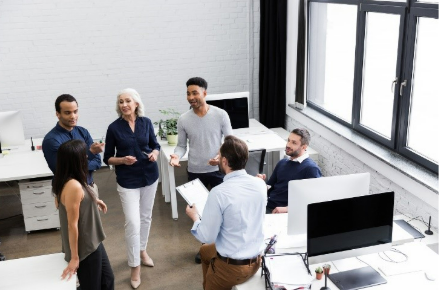 A group of people collaborating in the workplace
